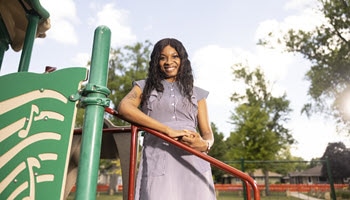 Woman standing on playground equipment