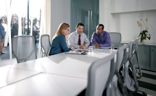group seated around conference table